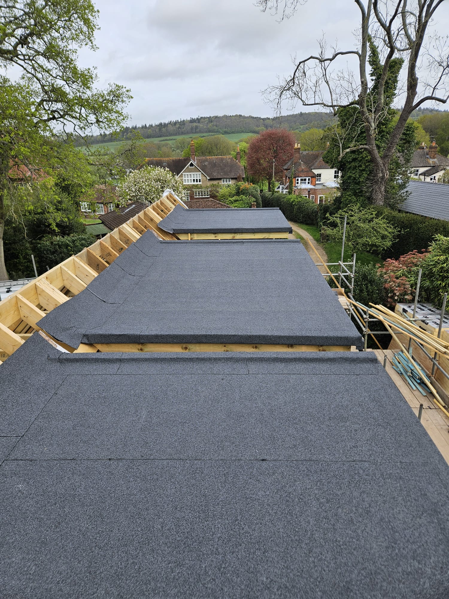 Felt covering laid over new roof timbers on a Surrey property