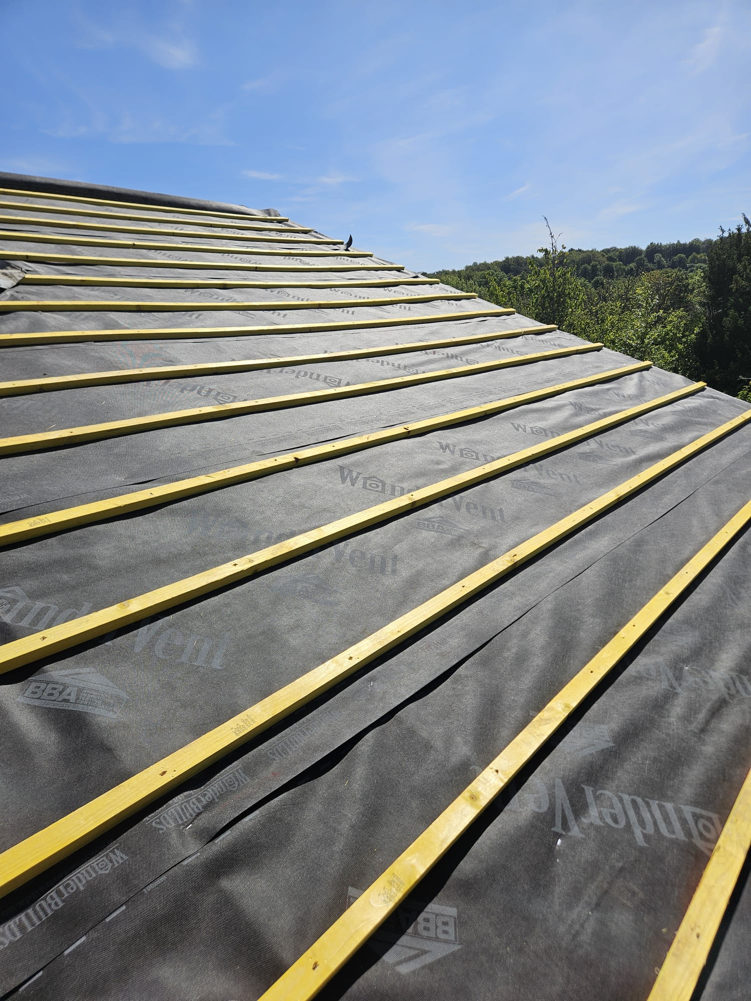 New membrane and battens running up to the ridge on a Surrey re-roof