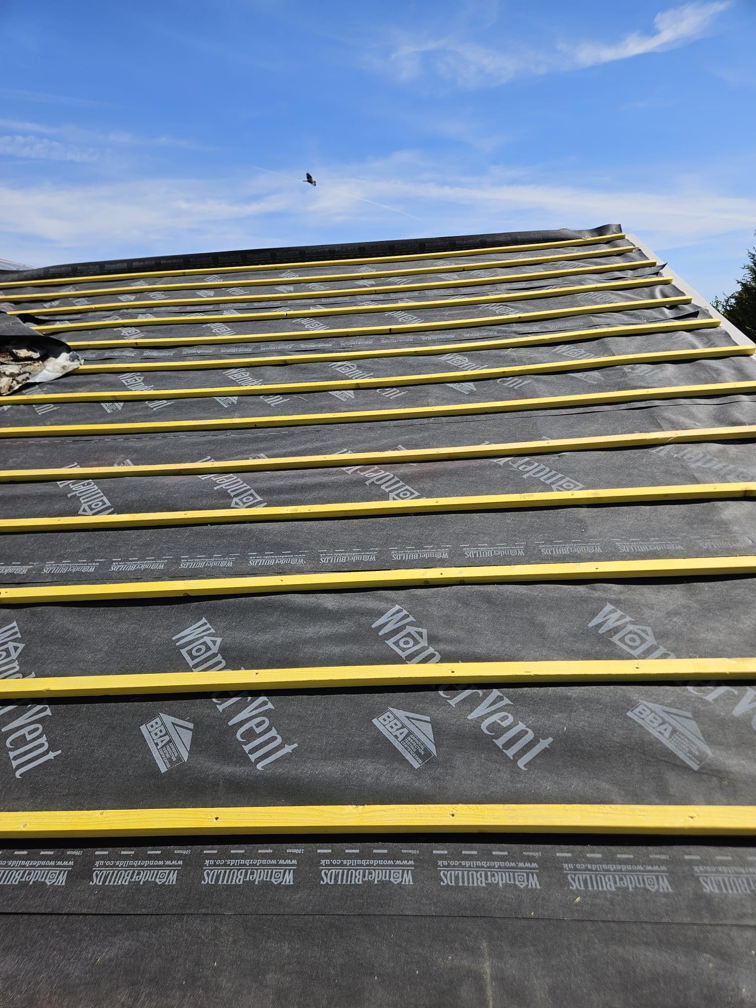 Full roof battened out over new breathable membrane on a Surrey house